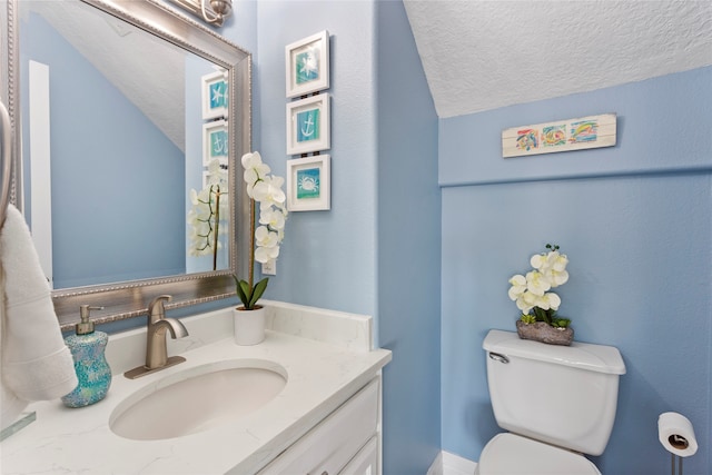 1815 Tiki Dr, Tiki Island, TX 77554 - half bathroom with a textured ceiling, toilet, and vanity