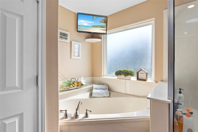 1815 Tiki Dr, Tiki Island, TX 77554 - bathroom with a bath