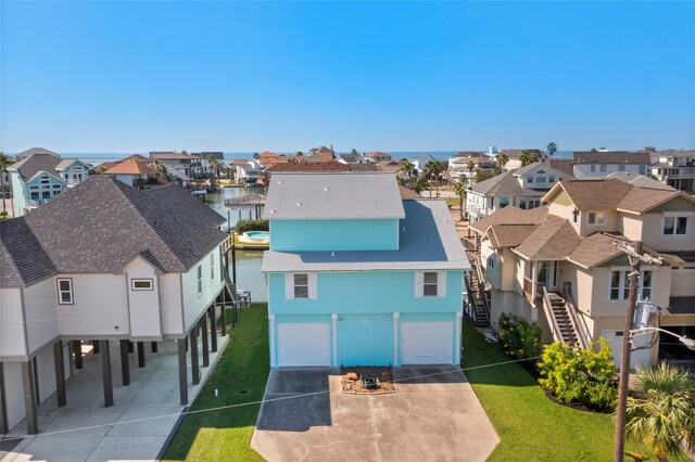 1815 Tiki Dr, Tiki Island, TX 77554 - aerial view of residential area with a nearby body of water