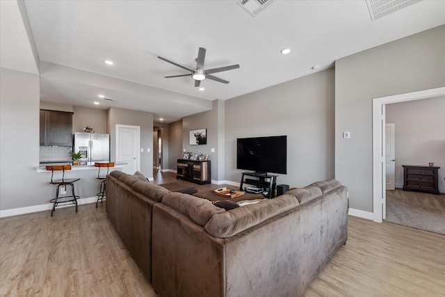 770 Dogberry Ct, Conroe, TX 77304 - living room featuring light wood-type flooring, ceiling fan, baseboards, and recessed lighting