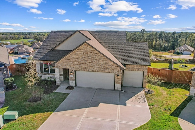 770 Dogberry Ct, Conroe, TX 77304 - view of front of home with concrete driveway, brick siding, roof with shingles, a garage, and a residential view