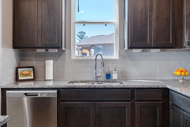 770 Dogberry Ct, Conroe, TX 77304 - kitchen with dishwasher, a sink, dark brown cabinetry, and backsplash