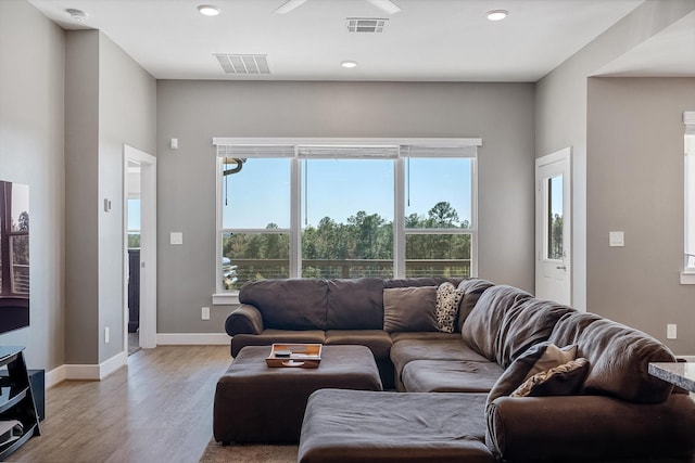 770 Dogberry Ct, Conroe, TX 77304 - living area featuring light wood finished floors, recessed lighting, and baseboards