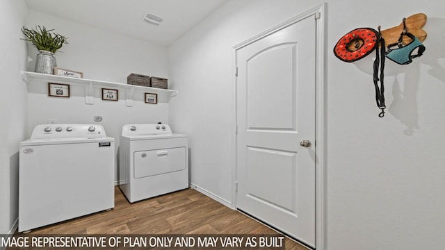 23792 Patchouli Terrace Dr, Splendora, TX 77372 - laundry area with independent washer and dryer and wood finished floors