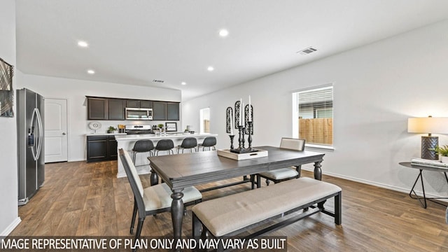 23792 Patchouli Terrace Dr, Splendora, TX 77372 - dining area featuring dark wood-style floors, recessed lighting, and baseboards
