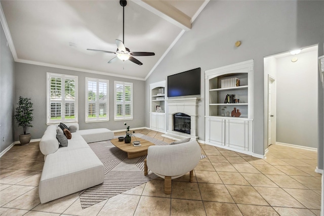 13614 Heath Spring Ct, Houston, TX 77044 - living room featuring ceiling fan, a glass covered fireplace, light tile patterned floors, baseboards, and beam ceiling