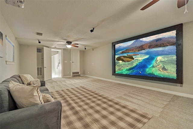 15471 Castlebrook Ct, Montgomery, TX 77316 - cinema with ceiling fan, light carpet, baseboards, and a textured ceiling