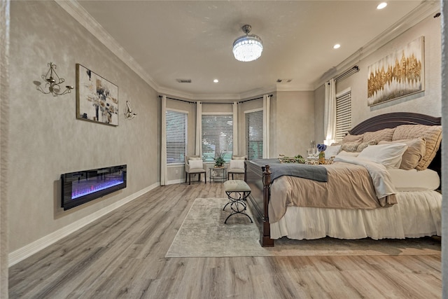 15471 Castlebrook Ct, Montgomery, TX 77316 - bedroom featuring a glass covered fireplace, wood finished floors, ornamental molding, baseboards, and recessed lighting
