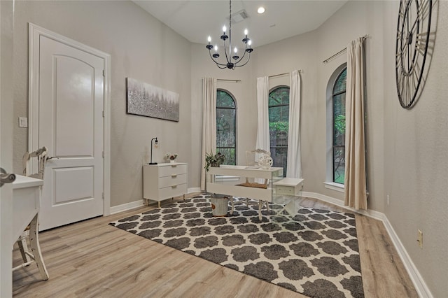 15471 Castlebrook Ct, Montgomery, TX 77316 - entrance foyer with wood finished floors, healthy amount of natural light, a chandelier, and baseboards