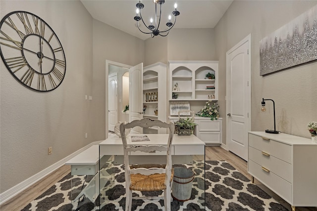 15471 Castlebrook Ct, Montgomery, TX 77316 - office space featuring light wood-style flooring, a chandelier, and baseboards
