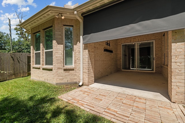 2037 Capriccio Dr, Spring, TX 77386 - view of side of home with brick siding and a patio