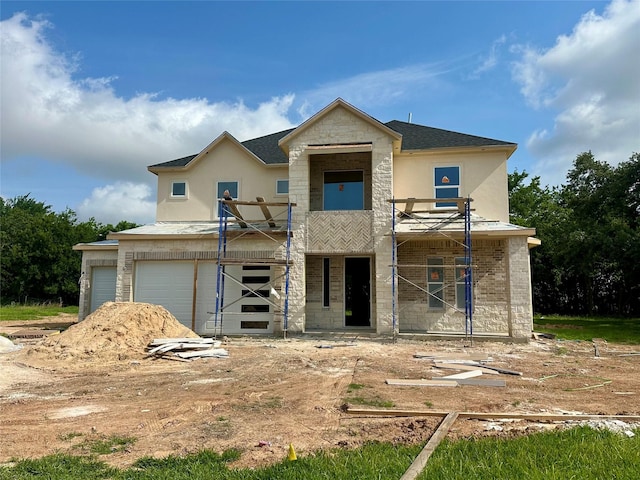10913 Houston Dr, La Porte, TX 77571 - unfinished property featuring stucco siding, an attached garage, and a balcony