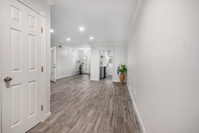 8245 Kingsbrook Rd Unit 139, Houston, TX 77024 - hallway featuring crown molding, dark wood-style floors, baseboards, and recessed lighting
