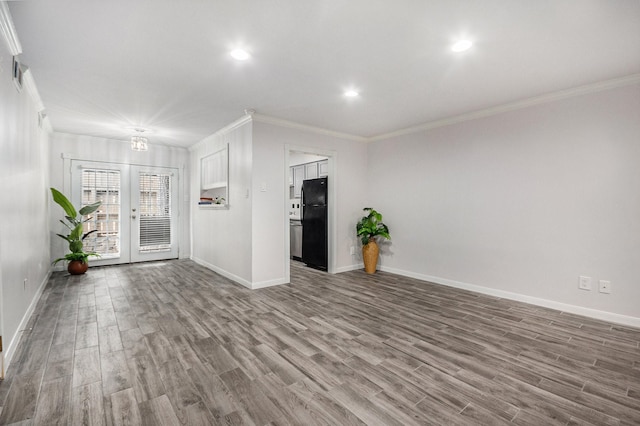 8245 Kingsbrook Rd Unit 139, Houston, TX 77024 - unfurnished room with crown molding, baseboards, wood finished floors, and recessed lighting