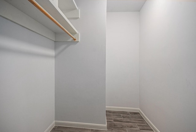 8245 Kingsbrook Rd Unit 139, Houston, TX 77024 - spacious closet with dark wood-type flooring