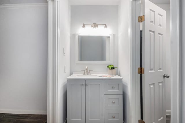 8245 Kingsbrook Rd Unit 139, Houston, TX 77024 - bathroom with vanity, baseboards, and wood finished floors