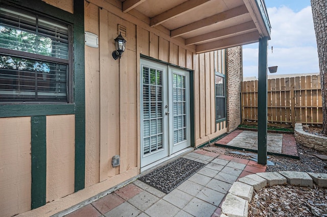 8245 Kingsbrook Rd Unit 139, Houston, TX 77024 - doorway to property featuring board and batten siding and a patio