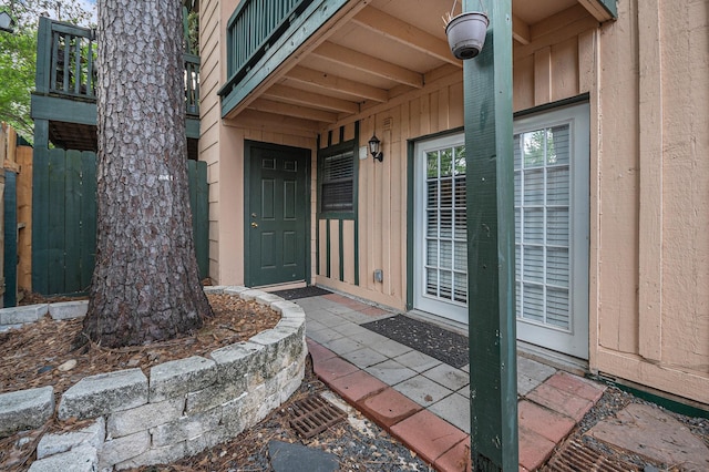 8245 Kingsbrook Rd Unit 139, Houston, TX 77024 - property entrance with board and batten siding and a surveillance system