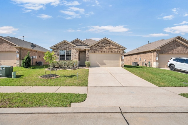 11355 Dawn Beach Ln, Conroe, TX 77304 - view of front of house with an attached garage, a front lawn, driveway, central AC unit, and stone siding