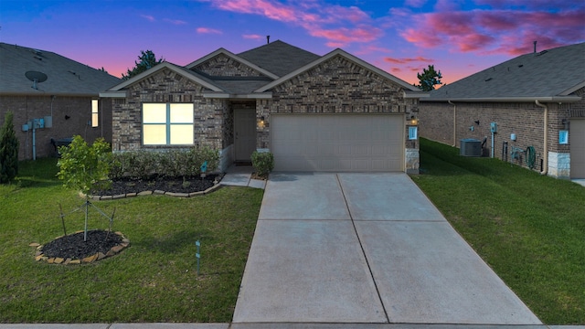 11355 Dawn Beach Ln, Conroe, TX 77304 - view of front facade featuring a garage, a front yard, driveway, and central AC unit