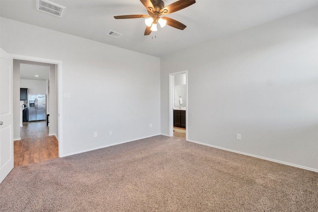 11355 Dawn Beach Ln, Conroe, TX 77304 - spare room featuring carpet, ceiling fan, and baseboards