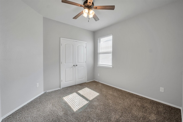 11355 Dawn Beach Ln, Conroe, TX 77304 - unfurnished bedroom featuring carpet, baseboards, and ceiling fan