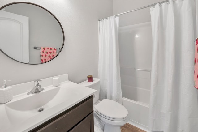 11355 Dawn Beach Ln, Conroe, TX 77304 - full bathroom featuring toilet, vanity, shower / bath combo with shower curtain, and wood finished floors