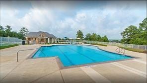 11355 Dawn Beach Ln, Conroe, TX 77304 - community pool featuring a patio