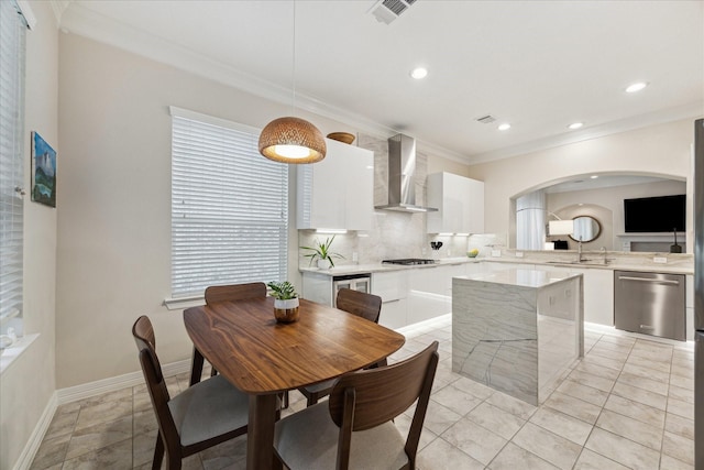 14402 Basalt Ln, Houston, TX 77077 - dining room with crown molding, arched walkways, recessed lighting, and baseboards