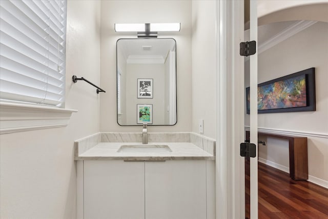 14402 Basalt Ln, Houston, TX 77077 - bathroom with ornamental molding, wood finished floors, vanity, and baseboards