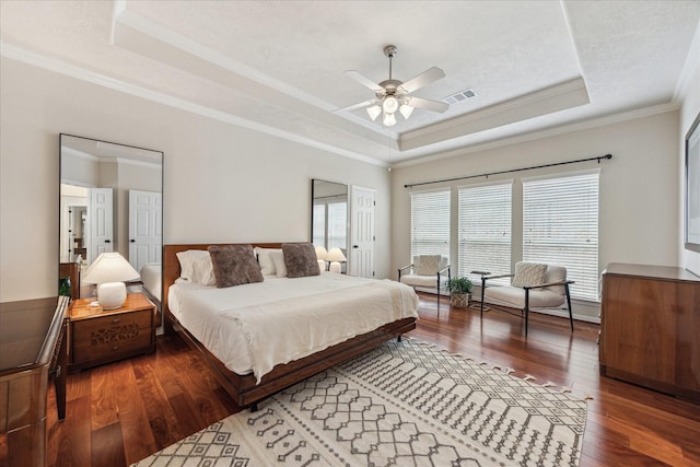 14402 Basalt Ln, Houston, TX 77077 - bedroom featuring a raised ceiling, ornamental molding, wood finished floors, and a ceiling fan