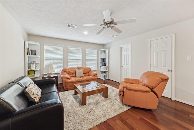 14402 Basalt Ln, Houston, TX 77077 - living room with baseboards, dark wood finished floors, ceiling fan, and a textured ceiling