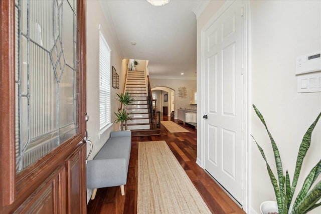 14402 Basalt Ln, Houston, TX 77077 - foyer entrance with stairway, arched walkways, ornamental molding, healthy amount of natural light, and dark wood-style flooring