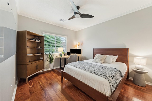14402 Basalt Ln, Houston, TX 77077 - bedroom with dark wood-style flooring, crown molding, baseboards, and a ceiling fan