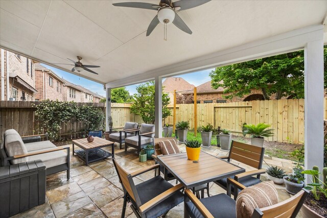 14402 Basalt Ln, Houston, TX 77077 - fenced backyard featuring an outdoor living space, ceiling fan, a patio area, and outdoor dining area