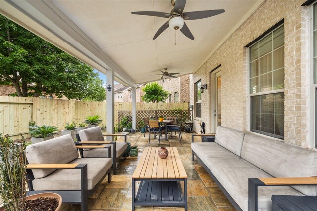 14402 Basalt Ln, Houston, TX 77077 - fenced backyard with an outdoor hangout area, a ceiling fan, and a patio area