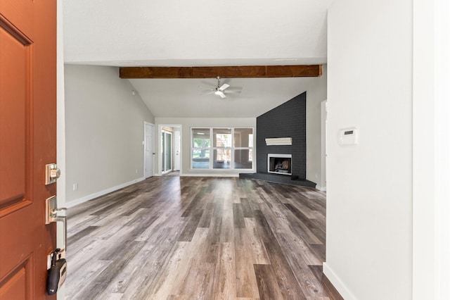 4434 Falcon Meadow Dr, Katy, TX 77449 - unfurnished living room featuring a ceiling fan, wood finished floors, baseboards, and a fireplace