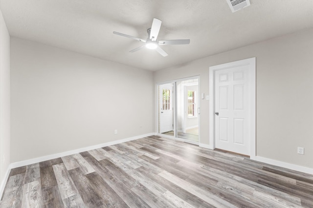 4434 Falcon Meadow Dr, Katy, TX 77449 - empty room with ceiling fan, wood finished floors, and baseboards