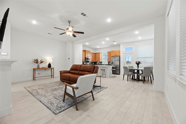 21106 Garden Palm Dr, Cypress, TX 77433 - living area with light wood finished floors, a ceiling fan, baseboards, and recessed lighting