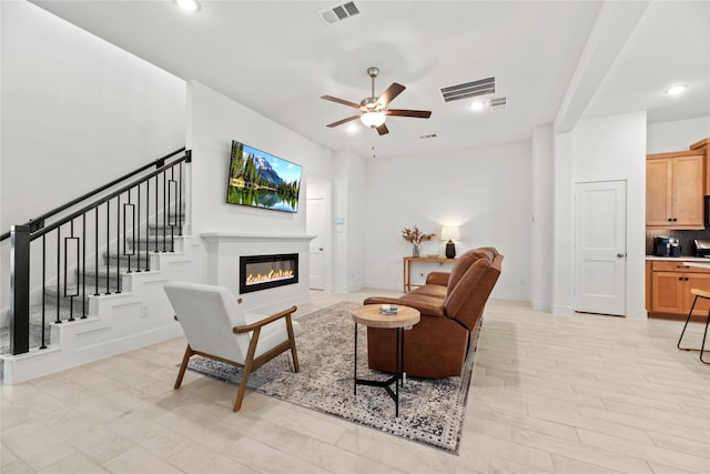 21106 Garden Palm Dr, Cypress, TX 77433 - living room with a ceiling fan, a glass covered fireplace, recessed lighting, and baseboards