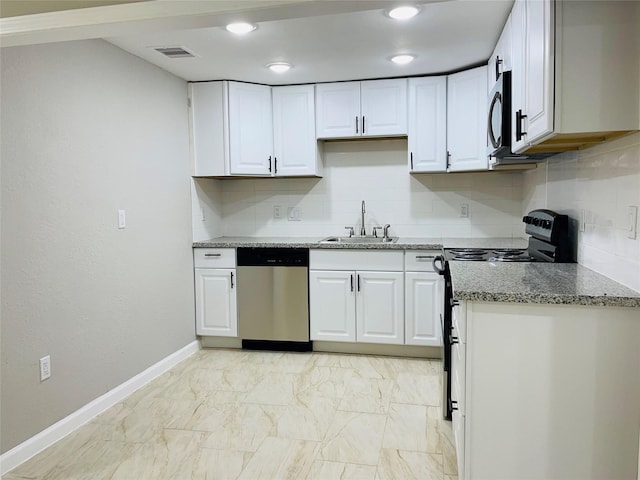 506 N Hackberry St, Sweeny, TX 77480 - kitchen featuring stainless steel appliances, a sink, backsplash, light stone counters, and white cabinetry