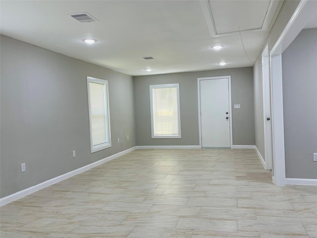 506 N Hackberry St, Sweeny, TX 77480 - spare room featuring attic access, baseboards, and recessed lighting