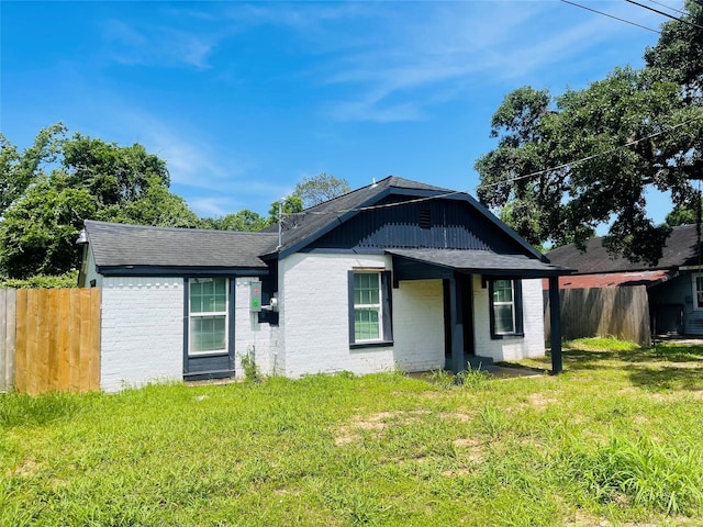 506 N Hackberry St, Sweeny, TX 77480 - view of front of home with brick siding and roof with shingles