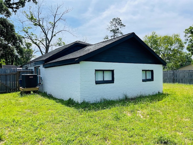 506 N Hackberry St, Sweeny, TX 77480 - view of home's exterior featuring central air condition unit, brick siding, and roof with shingles