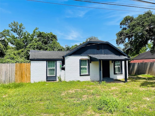 506 N Hackberry St, Sweeny, TX 77480 - view of front of house with a shingled roof and brick siding