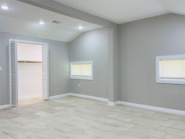 506 N Hackberry St, Sweeny, TX 77480 - unfurnished bedroom featuring lofted ceiling, recessed lighting, baseboards, a spacious closet, and a closet