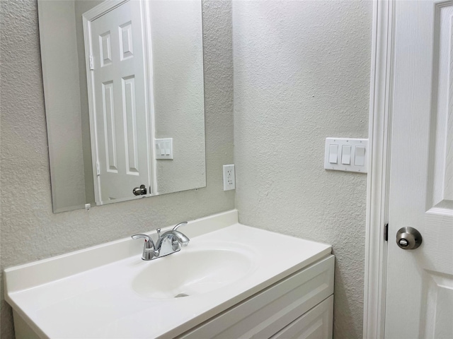 506 N Hackberry St, Sweeny, TX 77480 - bathroom with vanity and a textured wall
