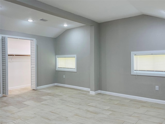 506 N Hackberry St, Sweeny, TX 77480 - unfurnished bedroom featuring vaulted ceiling, multiple windows, a closet, baseboards, and recessed lighting