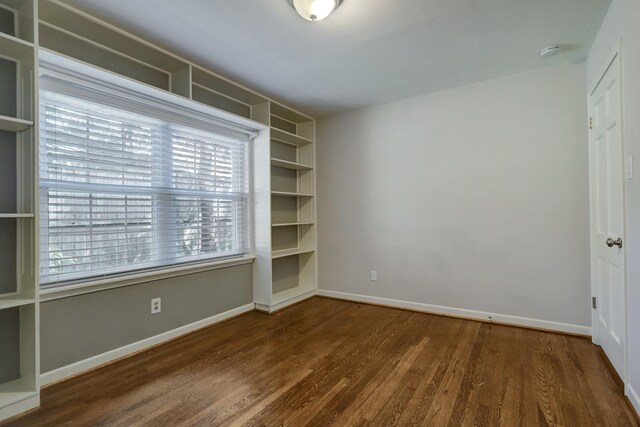 5215 Stillbrooke Dr, Houston, TX 77035 - unfurnished room with wood finished floors, baseboards, and a smoke detector