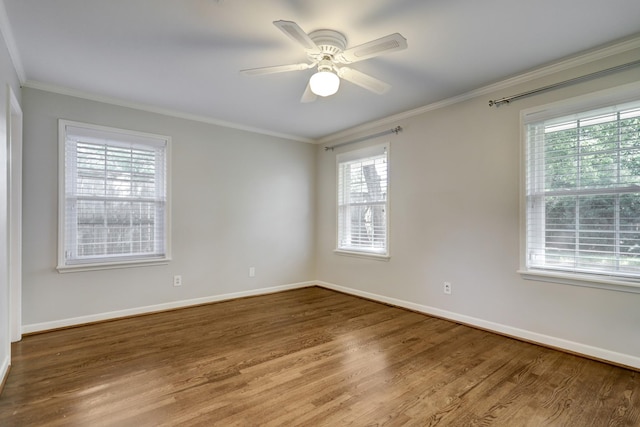 5215 Stillbrooke Dr, Houston, TX 77035 - unfurnished room with wood finished floors, healthy amount of natural light, crown molding, and baseboards